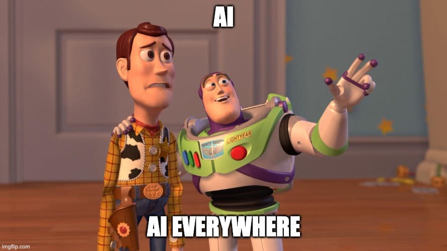 An image macro shows a screenshot from Toy Story. Buzz Lightyear gestures widely, with his other arm around a despondent Woody, and the text overlay reads "AI" at the top and "AI EVERYWHERE" at the bottom, suggesting the ubiquity of AI technology.